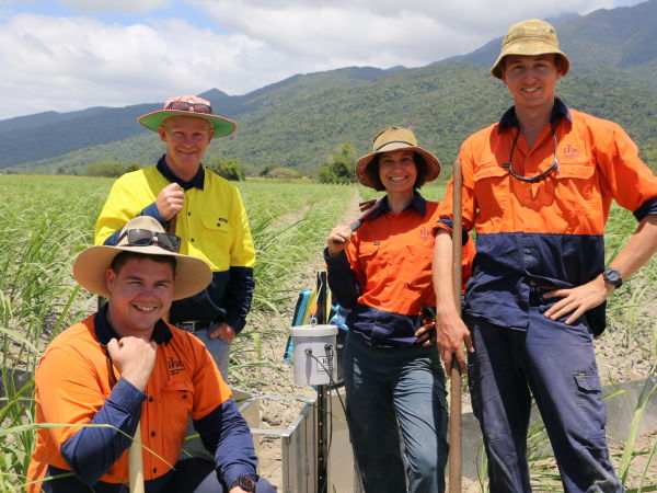 Photo credit-Sugar Research Australia.CAPTION-Gavin Rodman (SRA Adoption Officer)Mount Sophia farmer Glen Anderson,Belinda Billing(SRA Principal Researcher)&Chris Sterling(SRA Technician)installing water quality monitoring equipment.JPG